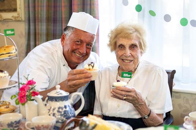 Chef Wayne Woolman and resident Joyce Wardle have been busy baking for Macmillan