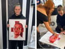 Ella Toone with the portrait that will be raffled off for BHF