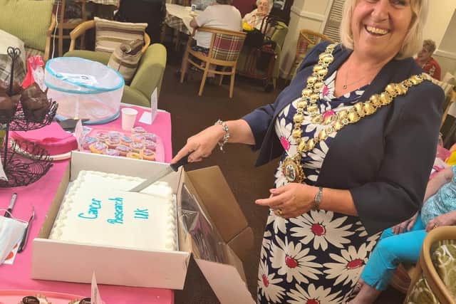 Mayor of Wigan, Coun Marie Morgan, cuts the cake