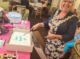 Mayor of Wigan, Coun Marie Morgan, cuts the cake