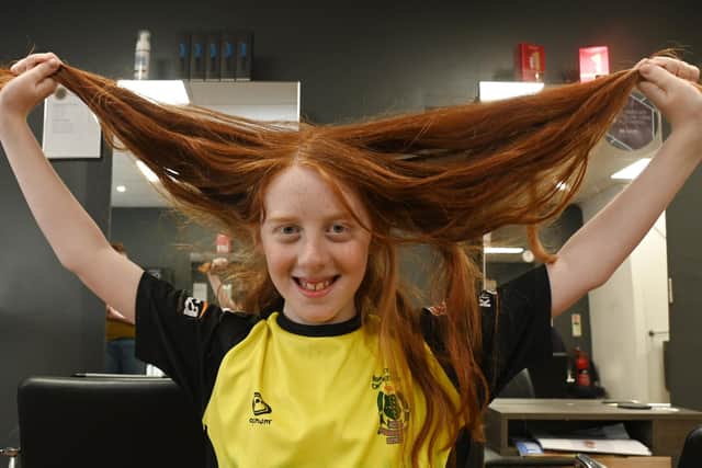 Noah Alexander, 11, prior to having his long locks cut off to donate to a variety of good causes close to his heart