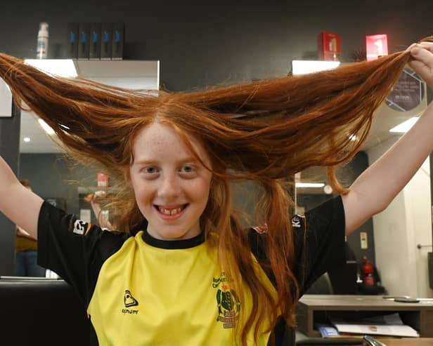 Noah Alexander, 11, prior to having his long locks cut off to donate to a variety of good causes close to his heart