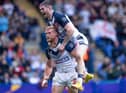 John Bateman celebrates with Luke Thompson