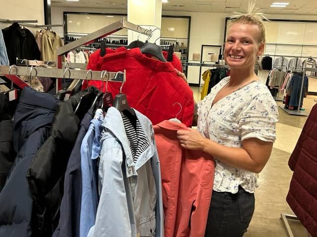 Karen Hill, head of retail for Rebuild with Hope, prepares the former Debenhams store for re-opening