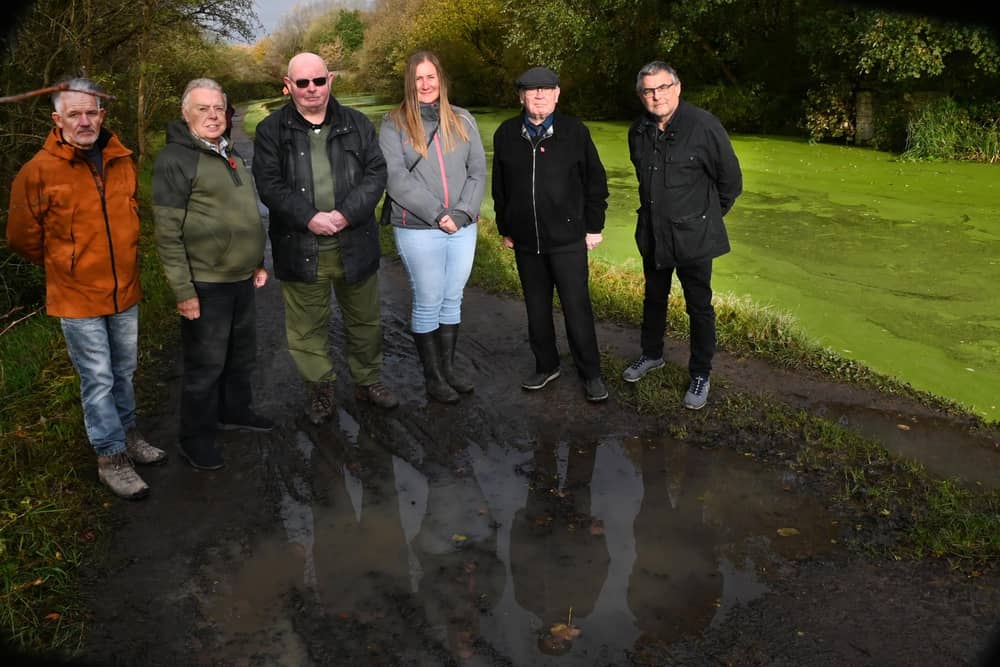 From left: Coun Lawrence Hunt, Coun Ron Conway, Coun Michael McLoughlin, Coun Laura Flynn, Coun George Davies and Coun Chris Ready on a canal towpath between New Springs and Haigh Hall.