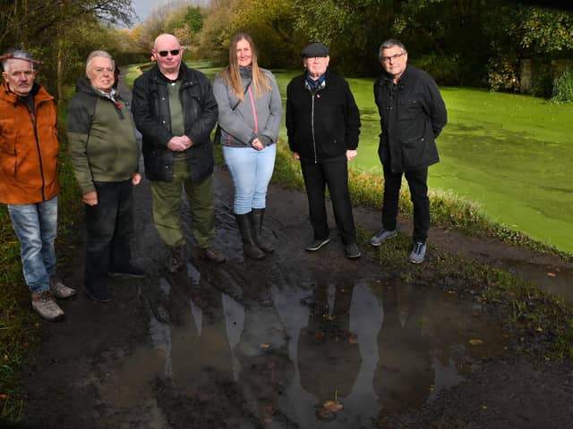 From left: Coun Lawrence Hunt, Coun Ron Conway, Coun Michael McLoughlin, Coun Laura Flynn, Coun George Davies and Coun Chris Ready on a canal towpath between New Springs and Haigh Hall.
