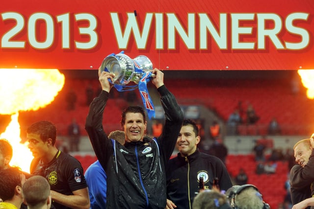 FA Cup Final 2013 - Wembley - Wigan Athletic v Manchester City - Goalkeeper Mike Pollitt lifts the FA Cup trophy.