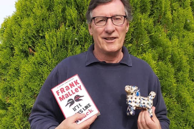 Frank Malley and his new release and dog made out of a cigarette box