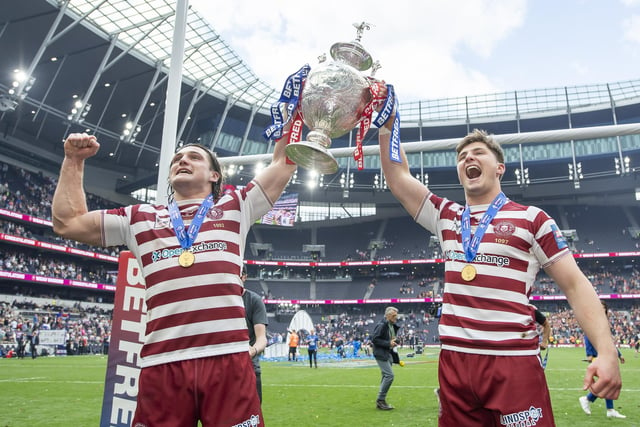 Liam Byrne and Ethan Havard celebrate with the trophy.