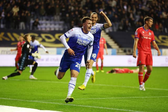 Nathan Broadhead scores the winning goal for Latics against Blackburn on October 2022