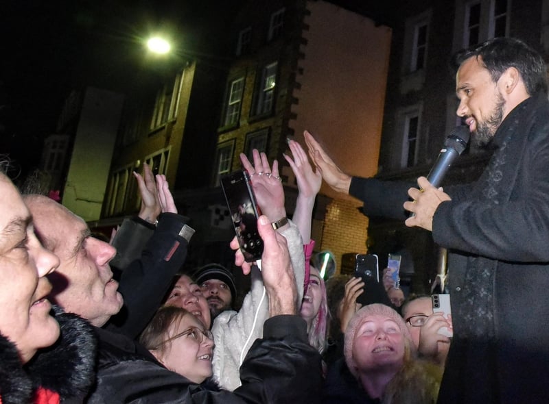 Gareth Gates high fives the crowds.