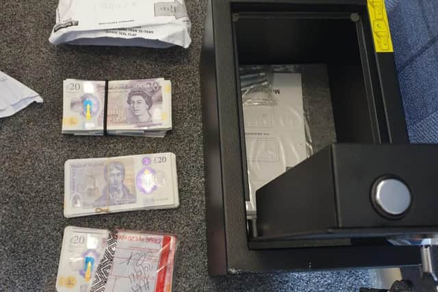 An estimated £10,000 in cash recovered from a strong box at one of the Marsh Green addresses