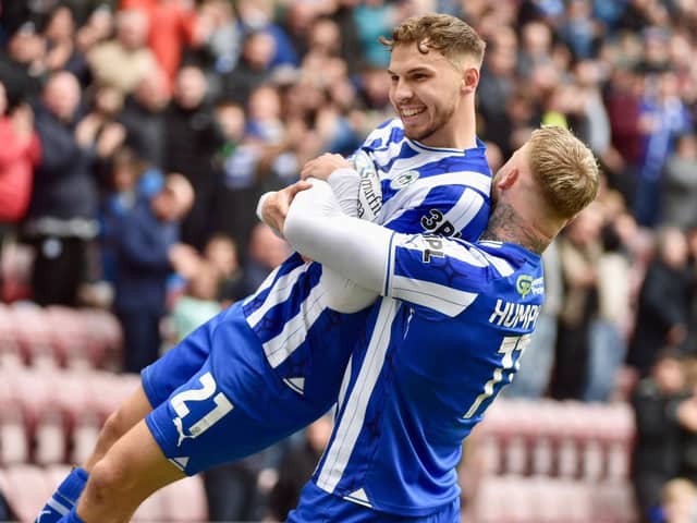 Scott Smith takes the congratulations from Stephen Humphrys after scoring the only goal against Blackpool