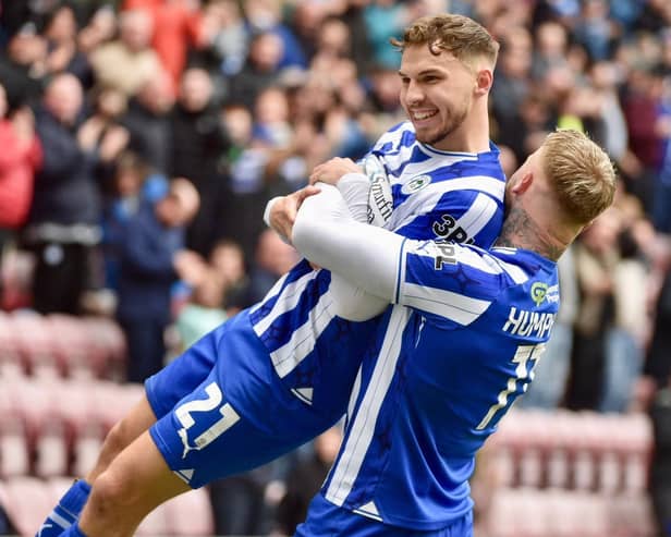 Scott Smith takes the congratulations from Stephen Humphrys after scoring the only goal against Blackpool