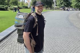 John Hilton in training for his epic trek, complete with a 30kg beer keg on his back