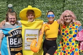 Councillors Lawrence Hunt, second from left, and Chris Ready, right, will wear fancy dress at the event