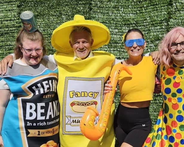 Councillors Lawrence Hunt, second from left, and Chris Ready, right, will wear fancy dress at the event