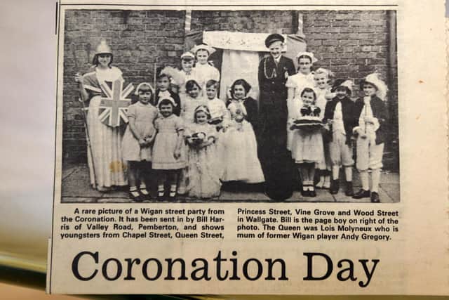 Jubilee memories - Wigan Observer reader Lois Gregory, pictured as the Queen (centre) with David Flanigan as the Duke of Edinburgh, pictuerd with children from Chapel Street, Queen Street, Princess Street, Vine Grove and Wood Street, Wigan - celebrating  the Queen's Coronation 70 years ago - this pictured was printed in the Wigan Observer.