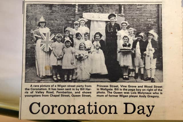 Jubilee memories - Wigan Observer reader Lois Gregory, pictured as the Queen (centre) with David Flanigan as the Duke of Edinburgh, pictuerd with children from Chapel Street, Queen Street, Princess Street, Vine Grove and Wood Street, Wigan - celebrating the Queen's Coronation 70 years ago - this pictured was printed in the Wigan Observer.