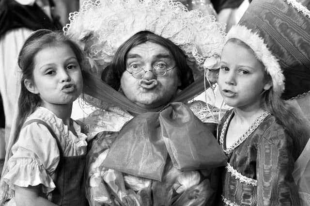 Comedian Les Dawson with imitators Louise Hawkes and Victoria Mason from Wigan's Betty Buckley dance school at a press call for the "Babes in the Wood" pantomime at the Palace Theatre, Manchester, on Thursday 12th of December 1985.