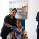 Student giving massage to Pauline, Frailty patient with Dan, Unit Manager