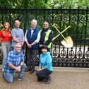 At the new Mowpin Lodge gates are, back row from left, construction project manager Ellie Colling, Dan Lea from Lost Art, Wigan Council leader Coun David Molyneux, Ian Kelly, site manager from HH Smith, front row, Coun Chris Ready and architect Sonoe Shimizu from Purcell Architects