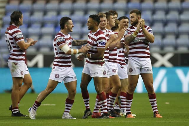 Bevan French celebrates with teammates after the game