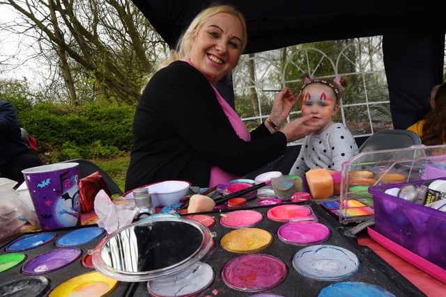 Julia Bradley-Brooks paints the face of Layla-Rose Cunliffe, four,