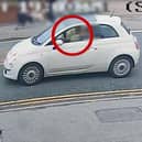 Louisa Tunstall at the wheel of her Fiat 500 moments before she caused a serious injury accident. The image shows a balloon in her mouth from which she was inhaling nitrous oxide