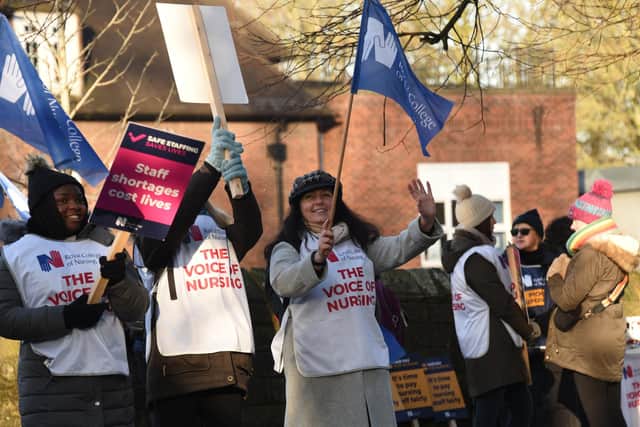 Staff from WWL holding a day of strike action outside Wigan Infirmary last month