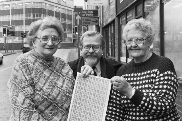 Retiring postmistress Edie Parr, left, with assistant Betty Smith and Wigan Observer reporter Geoff Shryhane outside the Darlington Street post office where Edie had served since 1942.  Geoff presented Edie with Wigan Observer newspaper cuttings from 1942 and she also received a long service certificate from the post office on Wednesday 4th of January 1995.