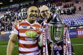 Wigan's Willie Isa with chairman Prof. Chris Brooks after victory over Penrith Panthers in February