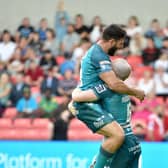 Abbas Miski celebrates with Liam Marshall