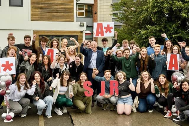 St John Rigby College students celebrate with principal Peter McGhee