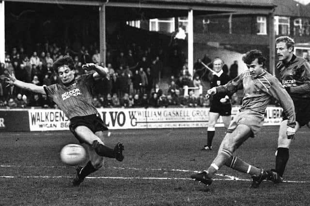 Wigan Athletic full-back Wayne Aspinall, brother of Warren, gets in a shot at goal against Plymouth Argyle in the Division 3 match at Springfield Park on Tuesday 3rd of April 1984. The game was a 1-1 draw with Stephen Johnson netting for Latics.
