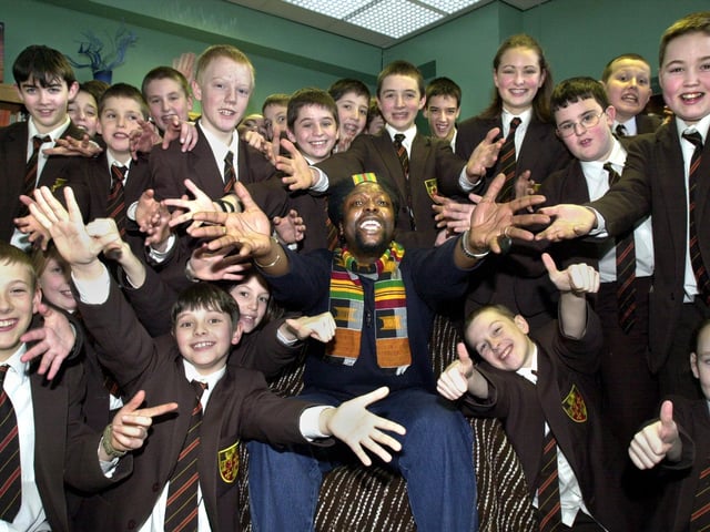 Pupils of St. Peter's RC High School, Orrell, join in a chant with Rastafarian poet Levi Tafari during a visit on Tuesday 5th of March 2002.