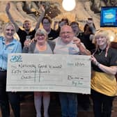 Elizabeth and Stephen Draper celebrate her big win with staff at BJ’s Bingo in Leigh