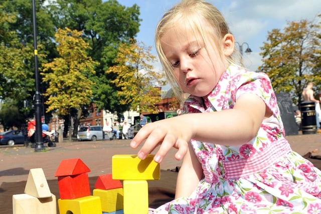Children play with Victorian toys in Civic Square, Leigh as part of the Leigh celebration weekend.
Pictured is Caitlin