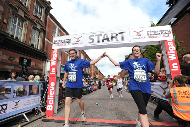 Joseph's Goal supporters celebrate finishing the first Wigan 10k in 2013