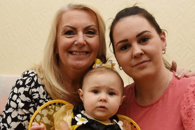 Phoebe Elliston, centre, with mum Lauren Elliston, right, and grandma Debbie Souter-Matthews, left.