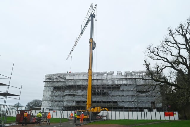 Scaffolding surrounding Haigh Hall is removed, part of the Haigh Hall project.