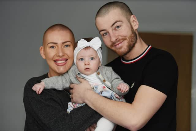 Estelle Wignall with husband Mike and their daughter Brooke last year