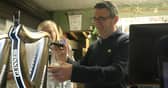 Andy Burnham pulls a pint