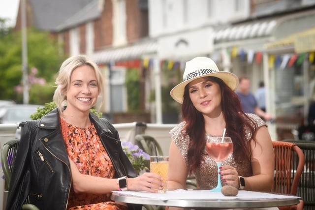 Sancha Clayton from Phase Eight and Whistles and Eleanor Binns from Mint Velvet modelling some of the festival fashions available at Stringers in Lytham.