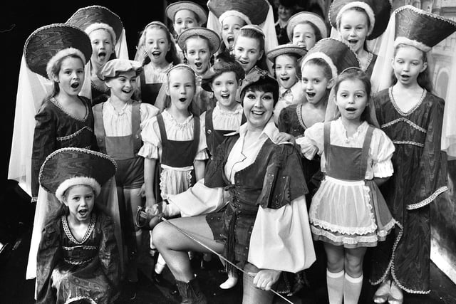 A rousing "Hi-de-Hi" from girls of Wigan's Betty Buckley dance school with actress Ruth Madoc who played Gladys Pugh in the television comedy "Hi-de-Hi" during a press call for the "Babes in the Wood" pantomime at the Palace Theatre, Manchester, on Thursday 12th of December 1985.