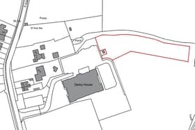 A red line describes the unused land wanted for the dog training school. Mossy Lea Road runs from top to bottom on the left of the picture