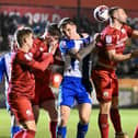 Jason Kerr tries to get his head to a Latics set-piece