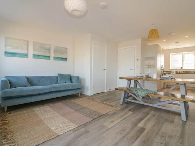 The Waves' open-planned living space with full kitchen and sociable relaxing and dining areas.