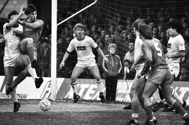 Paul Jewell battles for the ball with John Butler looking on in the Division 3 match against Bradford City at Valley Parade which Latics lost 4-2 on Saturday 12th of January 1985 with Alex Cribley and Mike Newell scoring Latic's goals.
On May 11th of that year 56 people died in the fire that engulfed the main stand during Bradford's match against Lincoln City.
