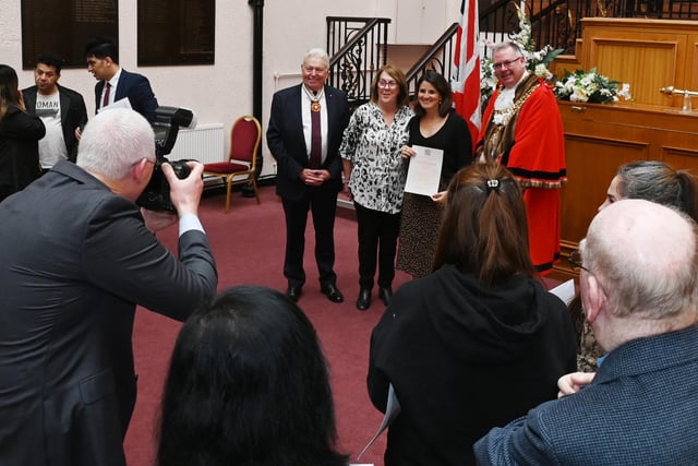 Posing for official photographs at the monthly British Citizenship ceremony held at Wigan Town Hall.